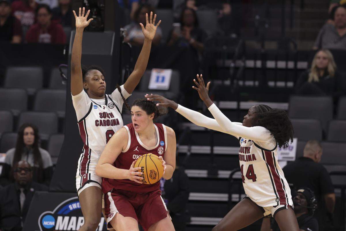 South Carolina's Joyce Edwards (8) and South Carolina's Agot Makeer (44) pressure Oklahoma's Raegan Beers (15) during the second half of action of their Sweet 16 women's basketball game against Oklahoma at Golden 1 Arena on Saturday, March 28, 2026.