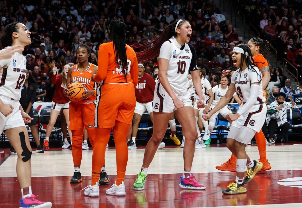 South Carolina’s Kamilla Cardoso (10) and South Carolina’s Destanni Henderson (3) celebrate after Cardoso drew a foul gainst the Miami Hurricanes during the second round of the NCAA Regional tournament on Sunday, March 20, 2022 at the Colonial Life Arena.