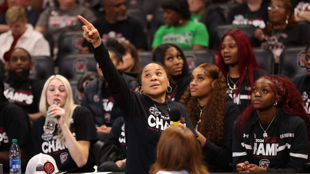 South Carolina head coach Dawn Staley points up to the big screen during the NCAA Selection Show for the Gamecocks’ at Colonial Life Arena in Columbia on Sunday, March 17, 2024.