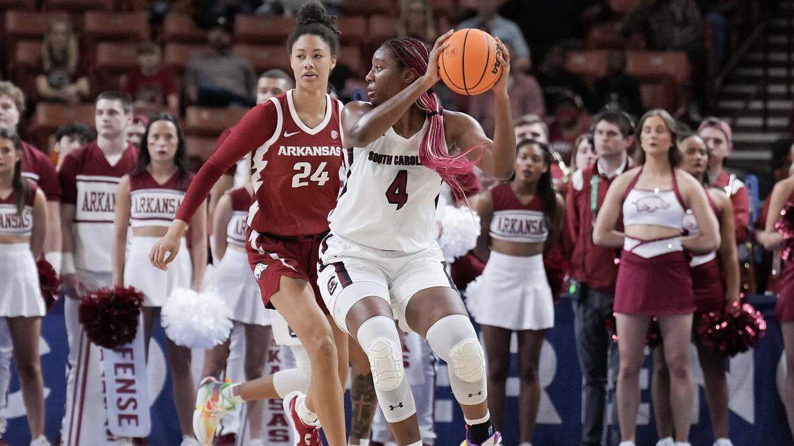 South Carolina Gamecocks forward Aliyah Boston (4) defends the ball Friday against Arkansas Razorbacks guard Jersey Wolfenbarger (24) in the first half at Bon Secours Wellness Arena.