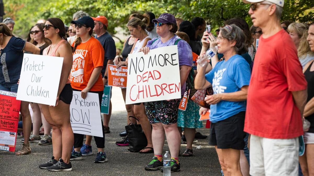 Protestors gather on the south side of the State House in support of gun control measures in Columbia, South Carolina on Saturday, June 11, 2022.