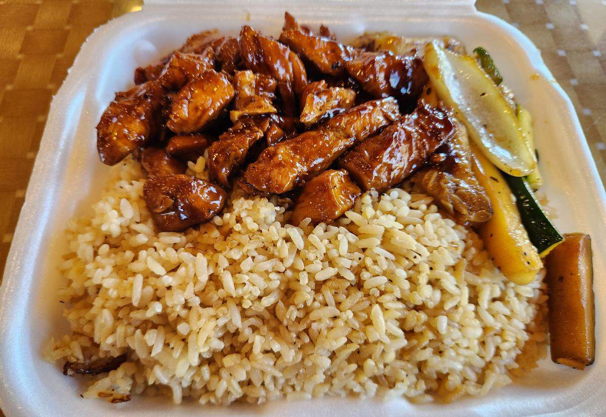 A plate of teriyaki chicken and fried rice from Tokyo Grill.