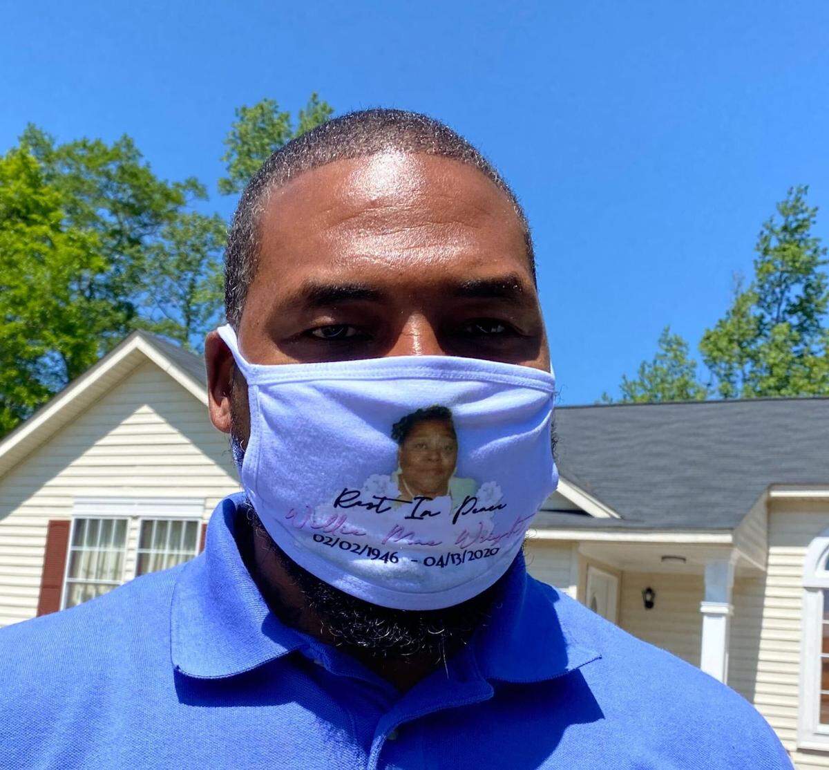 Calvin Wright along with other family members and friends wore masks that honored Willie Mae Wright during her funeral.