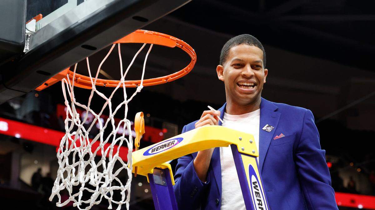 Then-USC assistant coach Winston Gandy cuts the net after winning the the National Championship game at the Rocket Mortgage FieldHouse in Cleveland, Ohio on Sunday April 7, 2024.