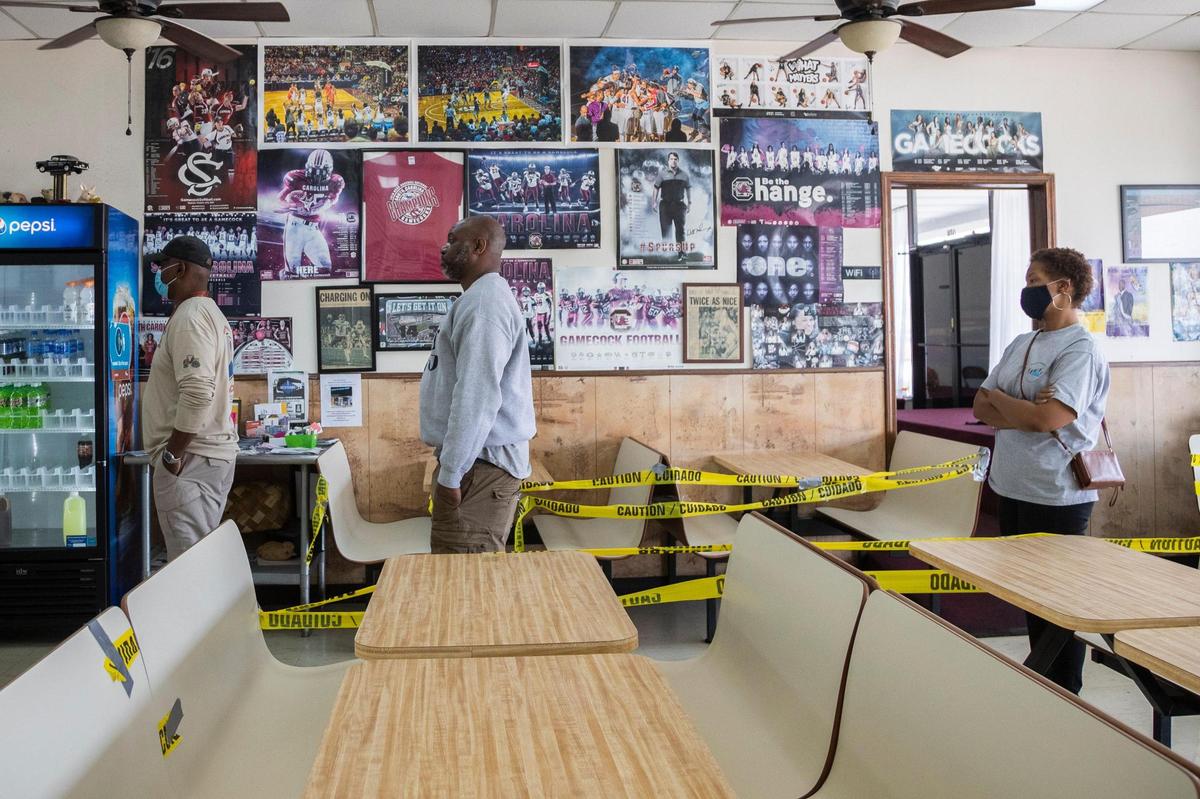 People wait in line for lunch at Big T Bar-B-Que in Columbia, South Carolina on February 11, 2022.