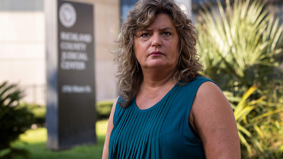 Former Richland County employee Teresa Cribb in front of the Richland County Justice Center on Wednesday, September 14, 2022. She has filed a lawsuit alleging courthouse security was negligent by allowing her attack last spring by a knife-wielding assailant.