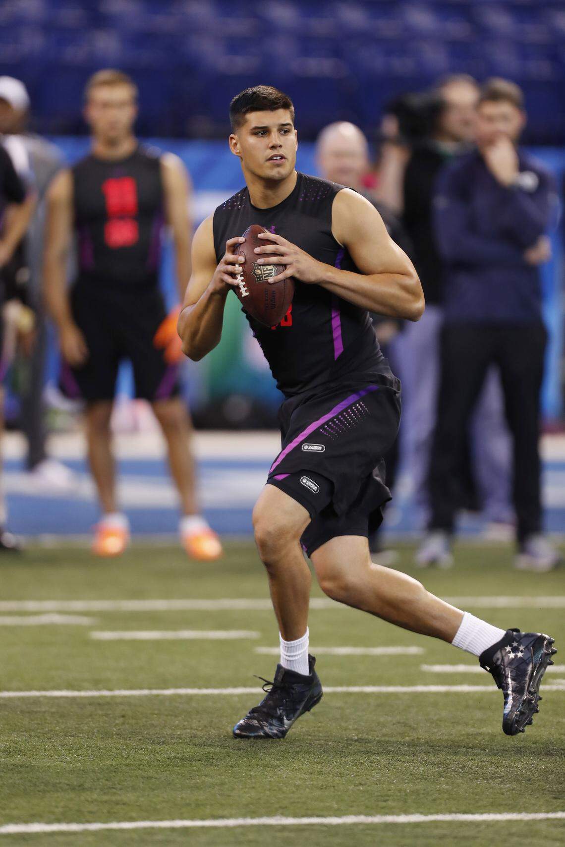 Former Oklahoma State quarterback Mason Rudolph goes through a workout at the NFL combine.