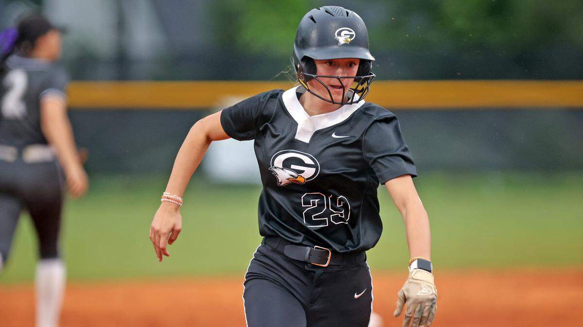 Gray Collegiate’s Anna Boyd rounds third and scores on an RBI single by Maliah Wright.