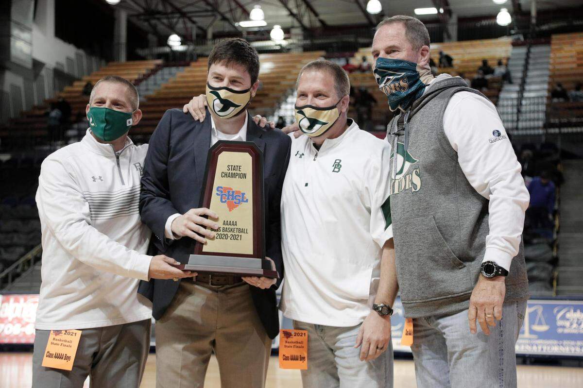 River Bluff coaches and school administration celebrate defeating Dorman in Aiken, South Carolina on Saturday, March 6, 2021.