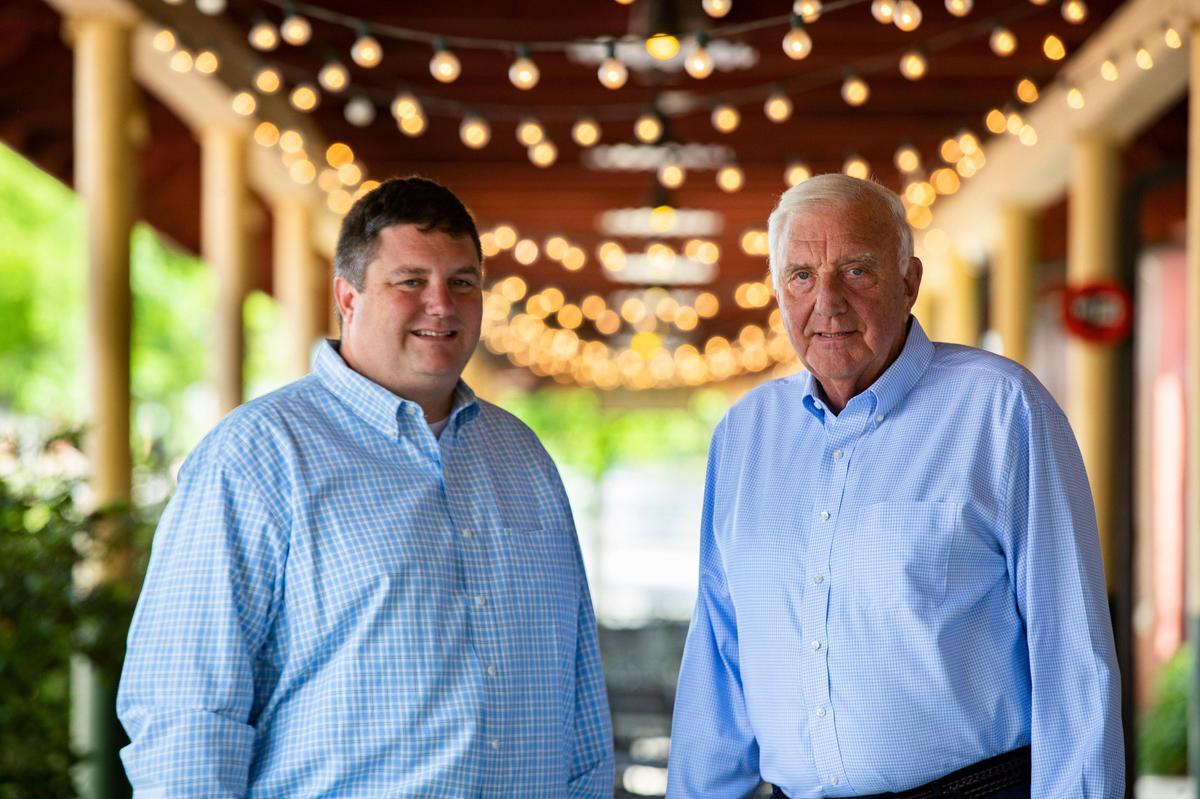 Bill Dukes and his son, Ryan Dukes, pose for a portrait outside their restaurant, the Blue Marlin, on Saturday, April 18, 2020. The restaurant is now serving take out after receiving federal assistance to stay open.