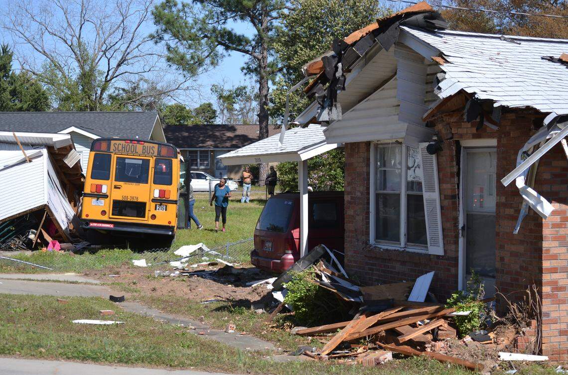A Sumter County school district bus ran off road, through two yards, striking a home and crashing into a storage shed.