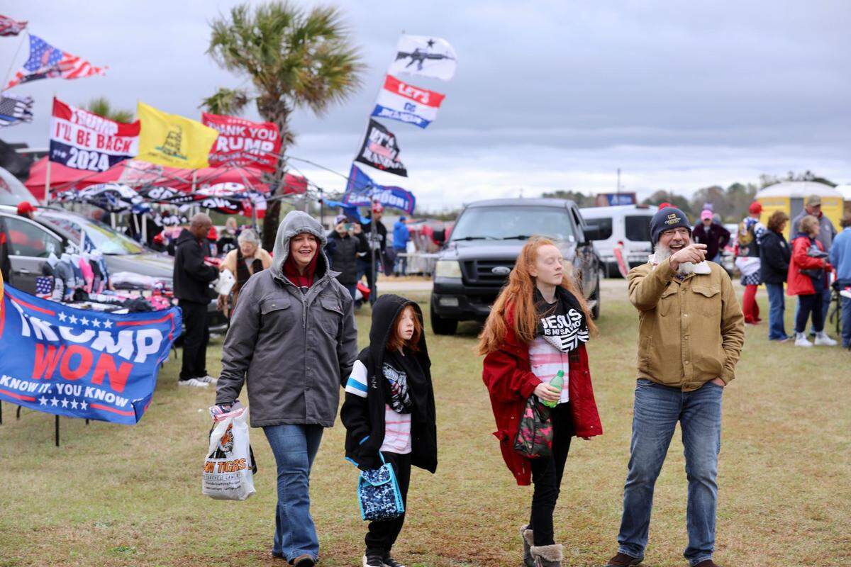 Supporters gather hours ahead of former President Donald Trump’s rally in Florence, S.C., on Saturday, March 12, 2022.