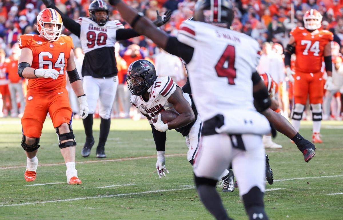South Carolina linebacker Demetrius Knight Jr. (17) pulls in an interception on Clemson’s last possession of the game during the second half of the Palmetto Bowl between South Carolina and Clemson at Memorial Stadium in Clemson on Nov. 30, 2024.