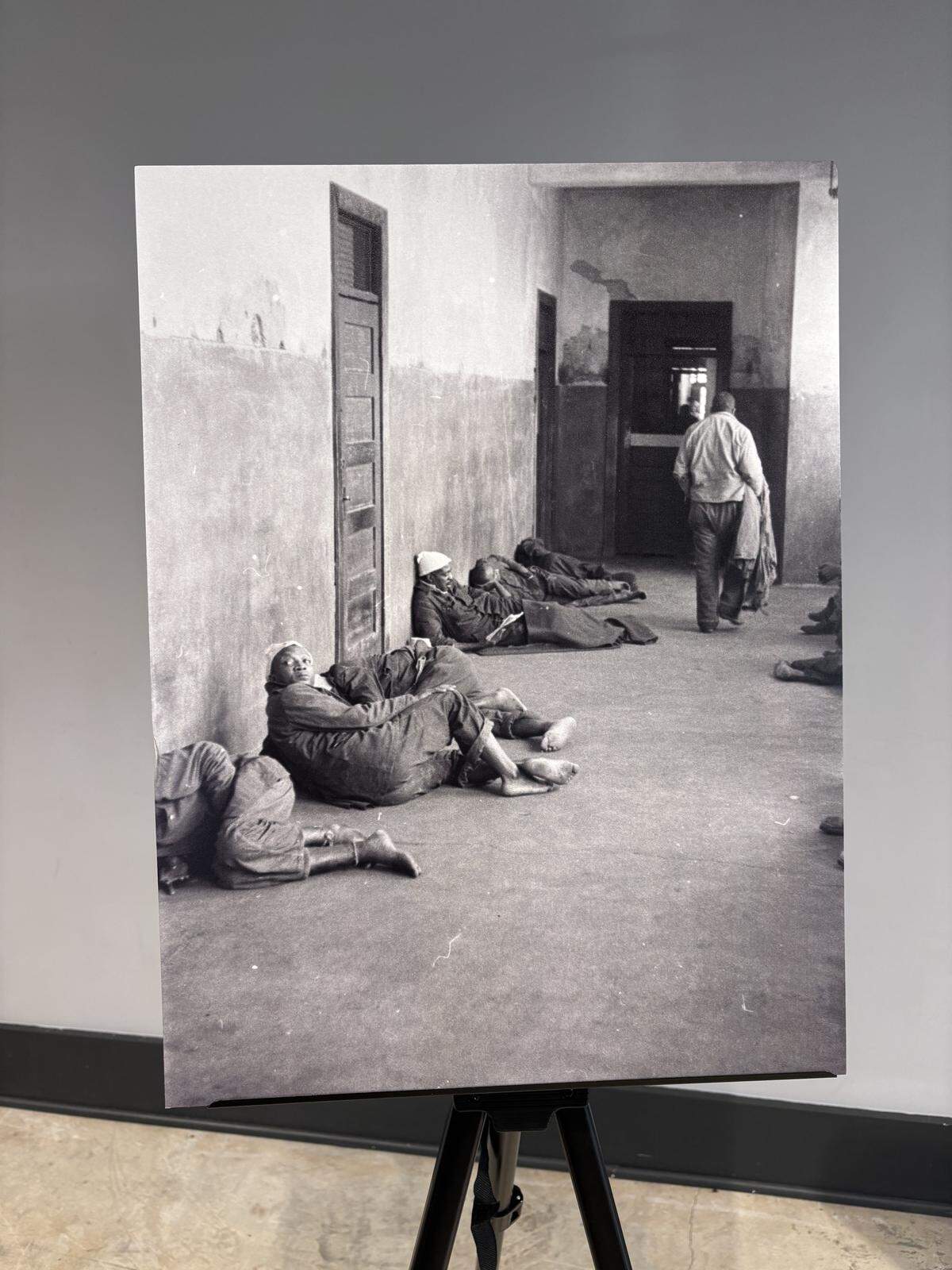 An image of patients laying on the floor of a ward, 1957, blown up and presented at the “People, not Patients” event Tuesday, March 24, 2026.