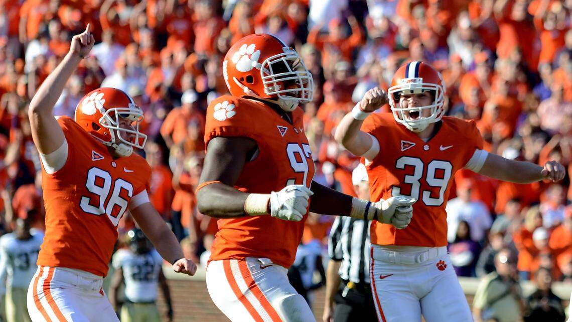 Clemson kicker Chandler Catanzaro (39) along with Dawson Zimmerman (96) and Malliciah Goodman, celebrate after Cantanzaro kicked the game-winning field goal as time-expired in the fourth quarter against Wake Forest on Saturday, Nov. 12, 2011.