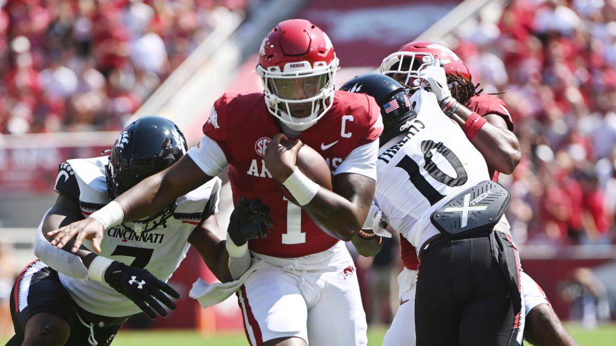 Arkansas quarterback KJ Jefferson (1) breaks through the Cincinnati defense to score a touchdown during their game Saturday