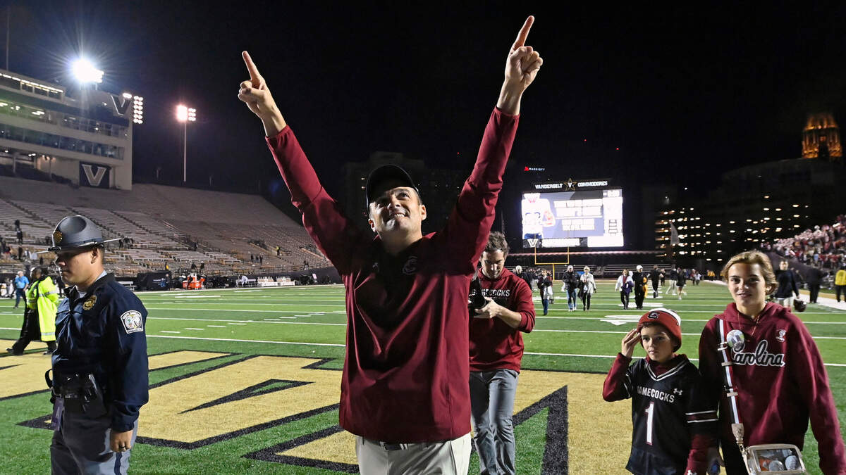 South Carolina head coach Shane Beamer, center, celebrates as he walks off the field after his team’s win over Vanderbilt in an NCAA college football game Saturday, Nov. 5, 2022, in Nashville, Tenn. (AP Photo/Mark Zaleski)