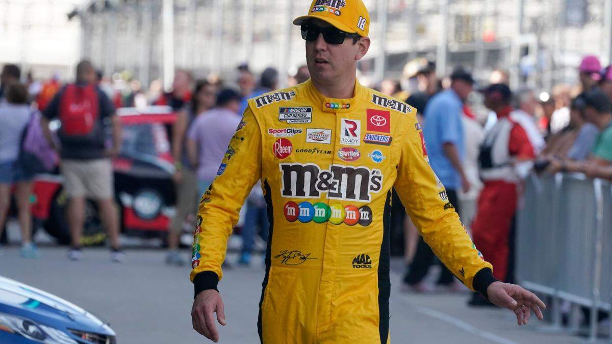 Kyle Busch walks to his garage during practice for the NASCAR Cup Series at Indianapolis Motor Speedway, Saturday, Aug. 14, 2021, in Indianapolis. (AP Photo/Darron Cummings)
