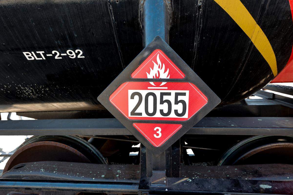 A safety placard on a rail car indicates the car is carrying a flammable liquid.