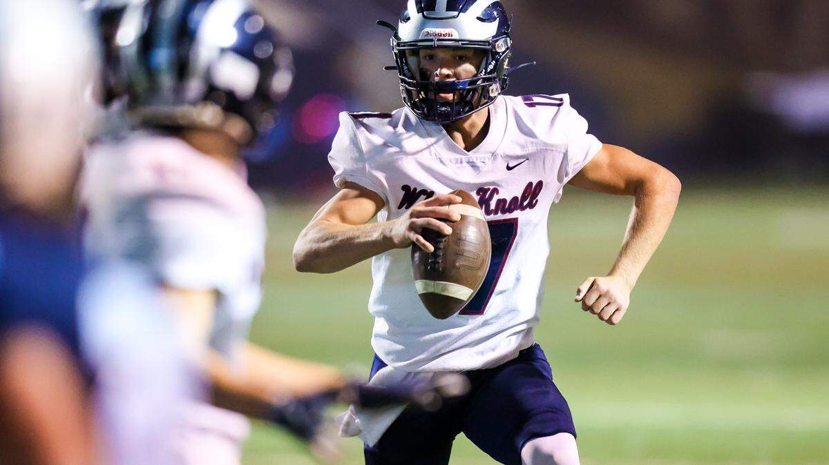 White Knoll Timberwolves quarterback Landon Sharpe (17) scrambles during their game at Chapin High School Friday, October 21, 2022.