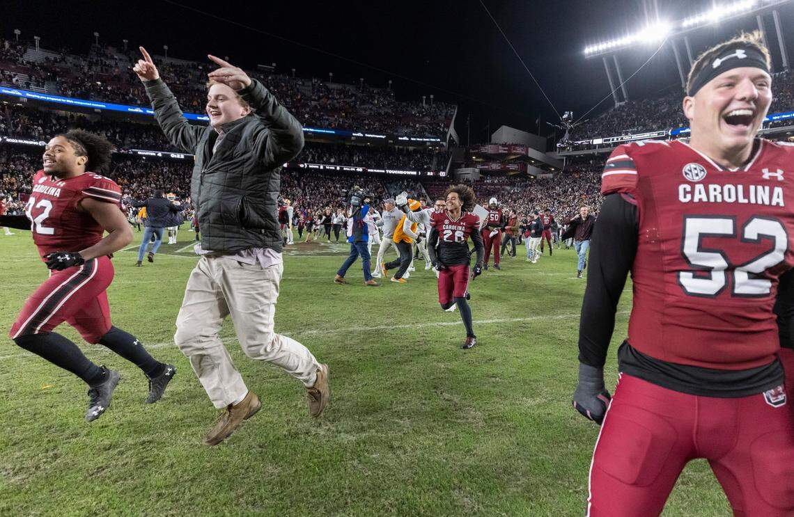 Fans rush the field at Williams-Brice Stadium in Columbia, SC on Saturday, Nov. 19, 2022.