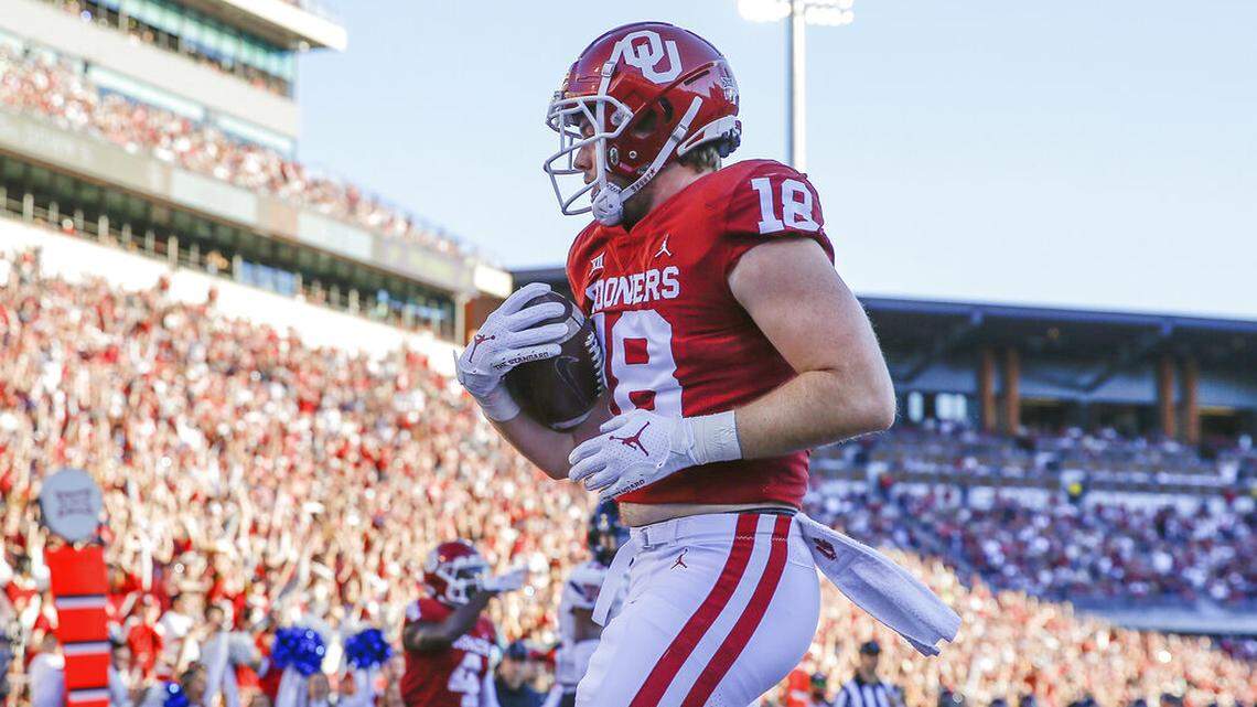 Oklahoma tight end Austin Stogner (18) runs in for a touchdown during the second half of an NCAA college football game against Texas Tech, Saturday, Oct. 30, 2021, in Norman, Okla. Oklahoma won 52-21.