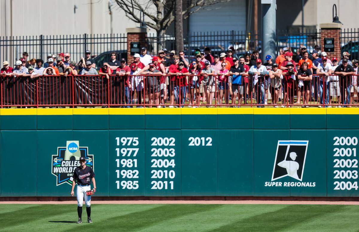 A large crowd watches from beyond South Carolina Gamecocks right fielder Petry (20) during the game against the Clemson Tigers at Founders Park in Columbia, SC, March 5, 2023.