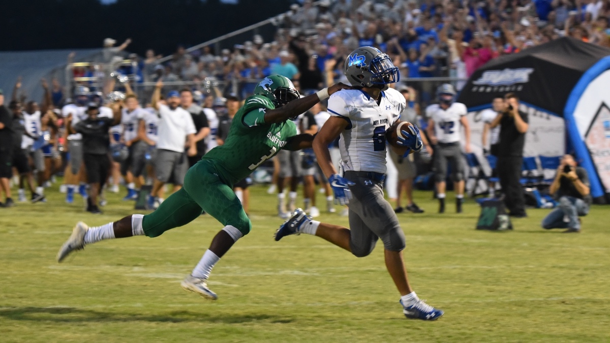 May River running back Brandon Morales scores a touchdown Friday night, outrunning Bluffton linebacker Ely’Jiah Mitchell.
