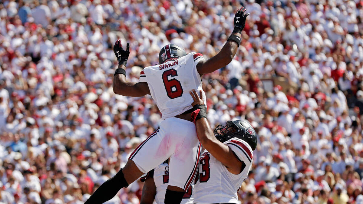 South Carolina’s Joshua Simon (6) and Vershon Lee (53), right, celebrate a touchdown by Simon in the second quarter, Saturday, Oct. 19, 2024, at Gaylord Family - Oklahoma Memorial Stadium in Norman, Okla.