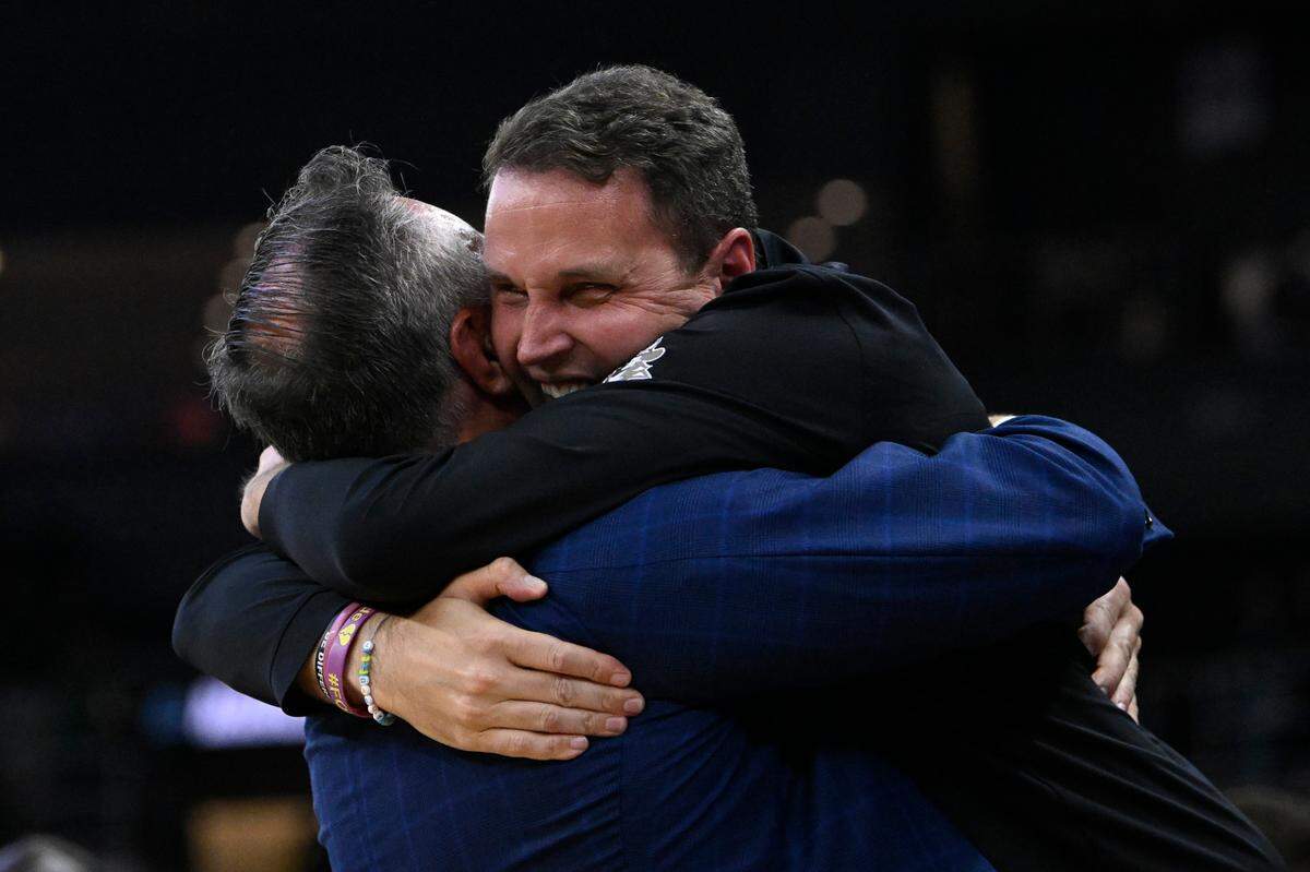 Mar 20, 2025; Providence, RI, USA; McNeese State Cowboys head coach Will Wade (right) celebrates with athletic director Heath Schroyer (left) after defeating the Clemson Tigers at Amica Mutual Pavilion