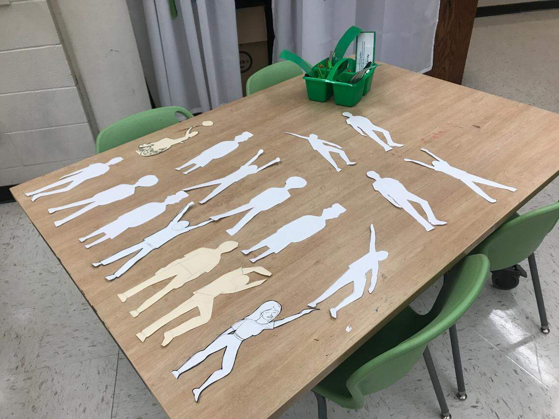 Figures drawn by fifth-graders at Nursery Road Elementary School and cut into metal by artist Bob Dover for a sculpture.