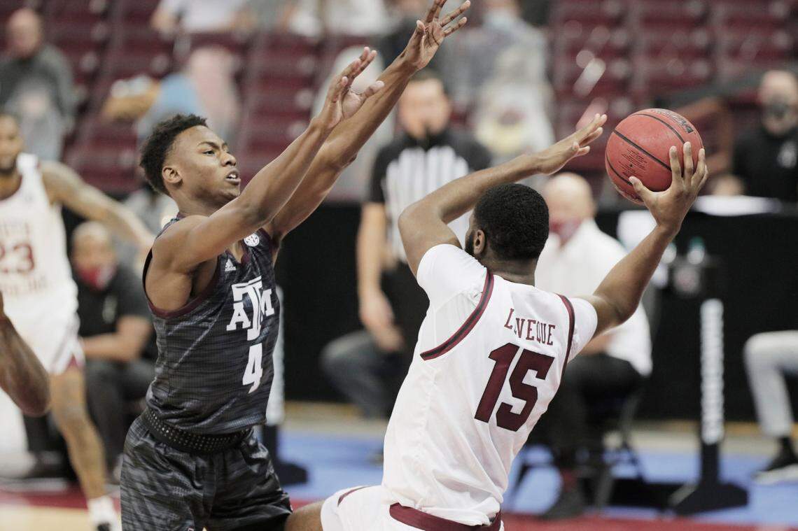 Texas A&M Aggies guard Jaxson Robinson (4) gaurds South Carolina Gamecocks forward Wildens Leveque (15) at Colonial Life Arena on Wednesday, January 6, 2021.