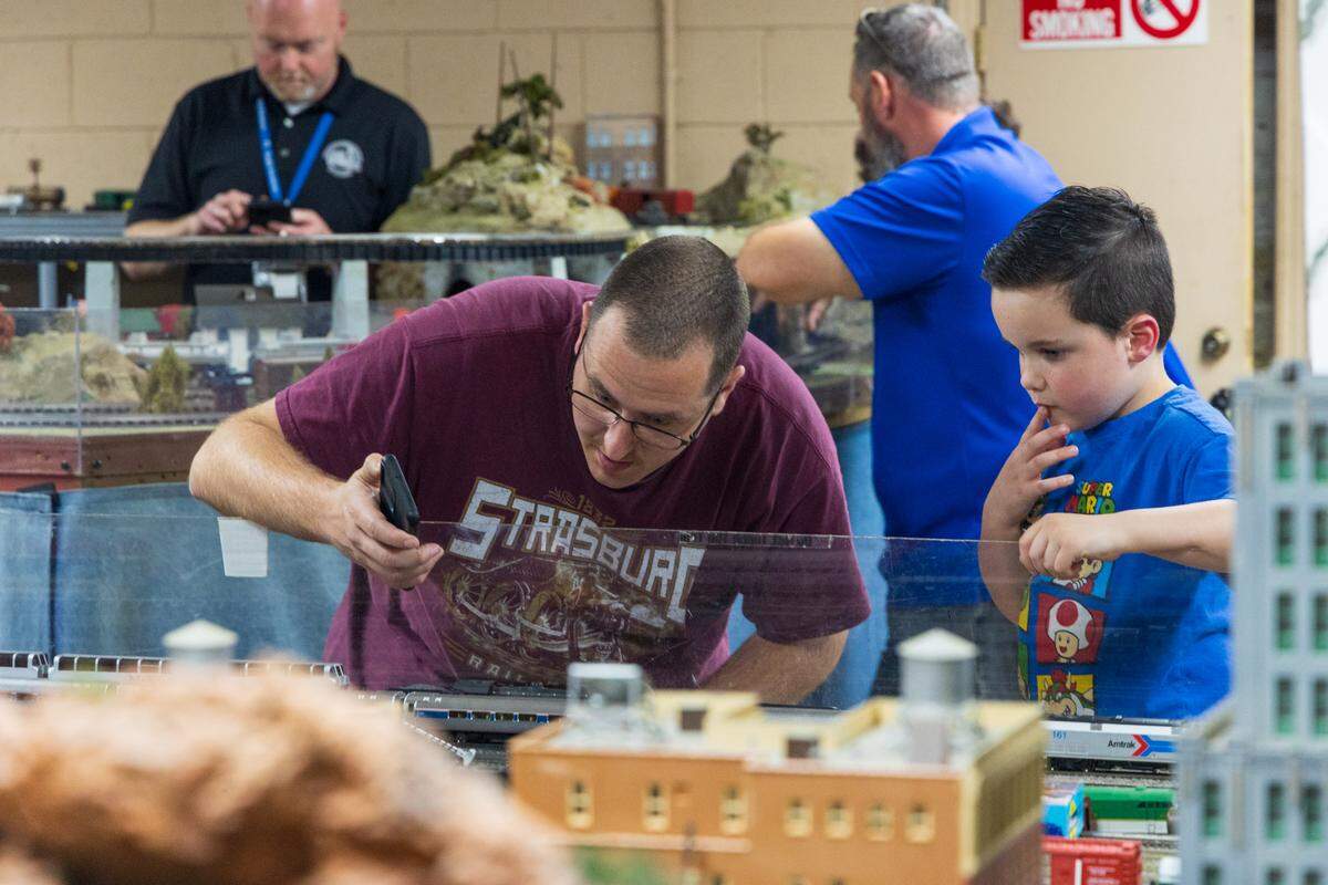 Model railroad enthusiasts show how to control model trains using a phone app at the Associated Model Railroads of Columbia, a club that meets Thursdays at 1800 Lincoln Street in Columbia, South Carolina, on Thursday, March 20, 2025.