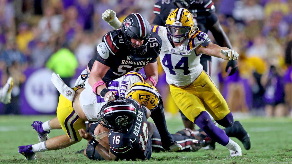 Linebacker Whit Weeks #40 of the Louisiana State Tigers sacks quarterback Lanorris Sellers #16 of the South Carolina Gamecocks for a 2-yard loss in the fourth quarter at Tiger Stadium on October 11, 2025 in Baton Rouge, Louisiana.