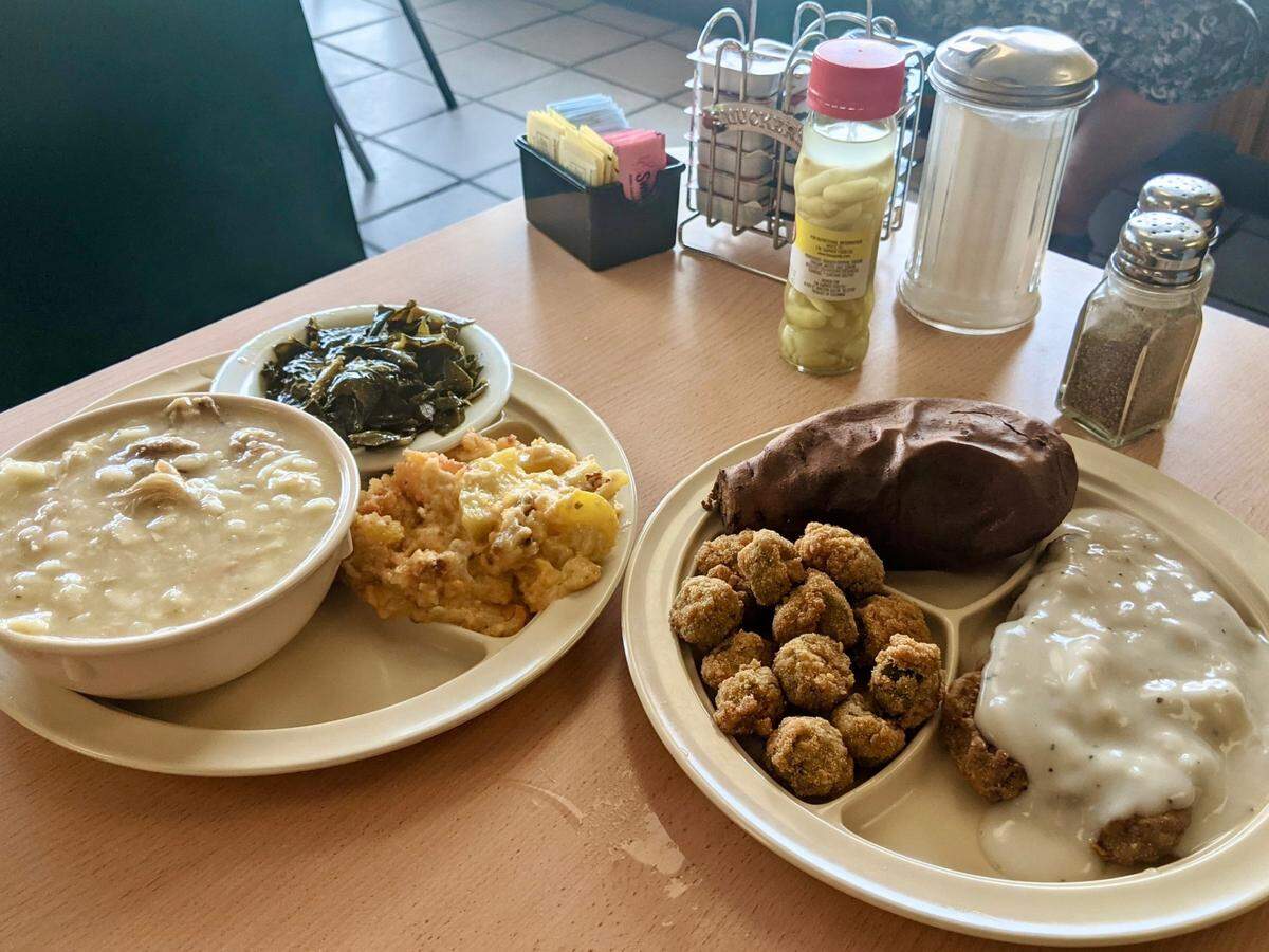 Collards, chicken and dumplings, baked mac and cheese, baked sweet potato, fried okra and chicken fried steak at Compton’s Kitchen.