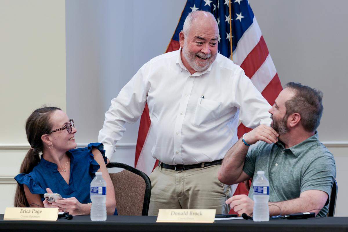 Interim Town Administrator Ed Driggers speaks with council members, Erica Page and Mayor Pro-Tem Donald Brock during the Blythewood town council meeting on Monday, August 25, 2025.
