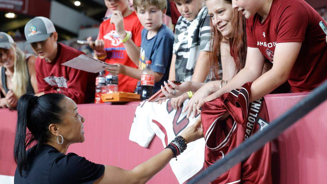 South Carolina head basketball coach Dawn Staley signs autographs during the Garnet & Black game at Williams Brice Stadium on Saturday, April 15, 2023.