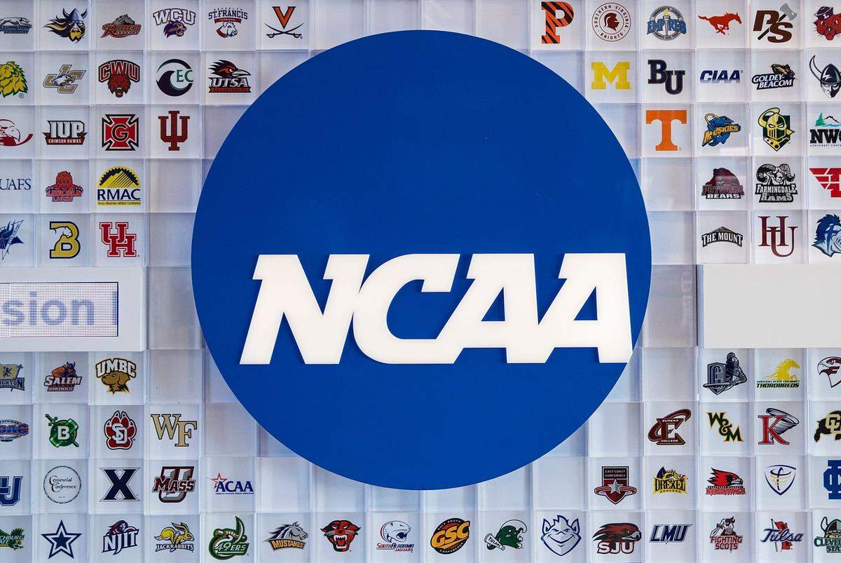 University logos cover a wall in the lobby of NCAA headquarters Thursday, Feb. 25, 2021, in Indianapolis. Ncaa National Collegiate Athletics Association Office Headquarters In Indianapolis Feb 25 2021