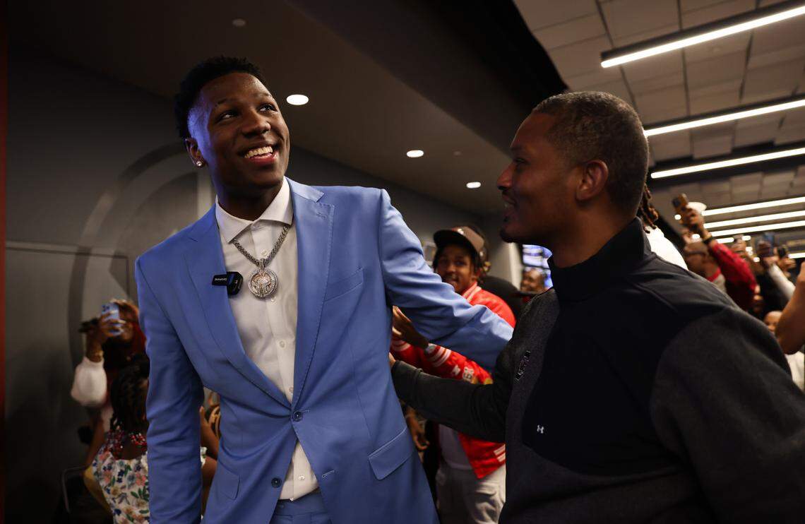 Gregory “GG” Jackson gets a hug from coach Lamont Paris after being drafted during his NBA Draft party.