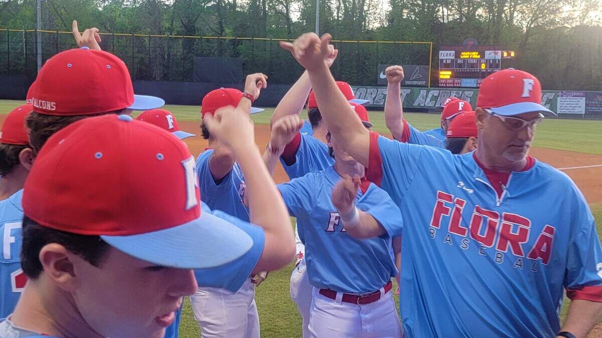 AC Flora baseball coach Andy Hallett and his team break a huddle before Tuesday’s game against Westminster Christian (Fla.) at the Forest Acres Classic.
