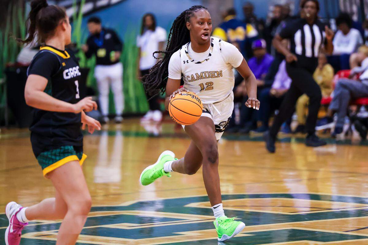 Camden Bulldogs Joyce Edwards (12) drives at the Chick-fil-A Classic at River Bluff High School Wednesday, Dec. 27, 2023.