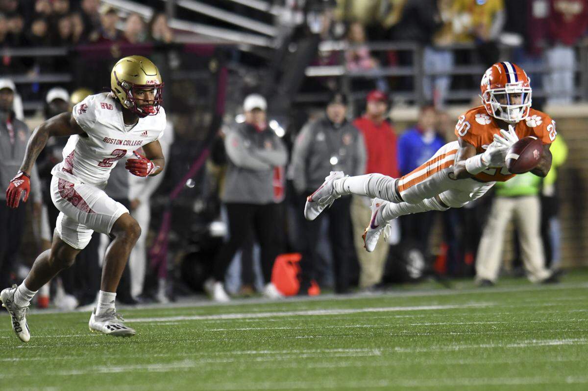 Clemson’s Nate Wiggins made an attempt to intercept a pass intended for Boston College’s Joseph Griffin during the first half of an NCAA college football game Saturday, Oct. 8, 2022, in Boston. (AP Photo/Mark Stockwell)