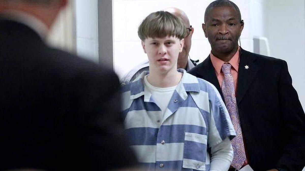 Dylann Roof enters the court room at the Charleston County Judicial Center Monday, April 10, 2017, to enter his guilty plea on murder charges in Charleston, S.C. The convicted Charleston church shooter, Roof was given nine consecutive life sentences in state prison after he pleaded guilty to state murder charges Monday, leaving him to await execution in a federal prison and sparing his victims and their families the burden of a second trial.