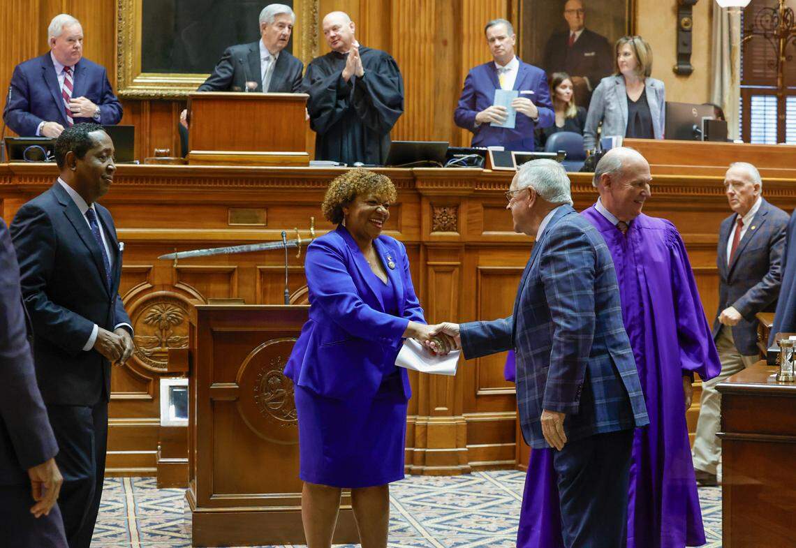 Sen. Tameika Isaac Devine, D-Richland greets senators on her first day in the senate at the South Carolina State House on Tuesday, Jan. 10, 2024.