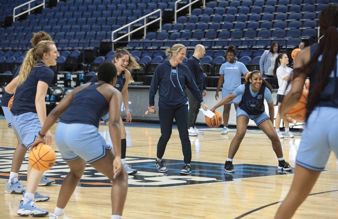 University of North Carolina head coach Courtney Banghart talks with her team during practice for their Sweet 16 game in the Greensboro Coliseum on Thursday, March 24, 2022. UNC will face The University of South Carolina.