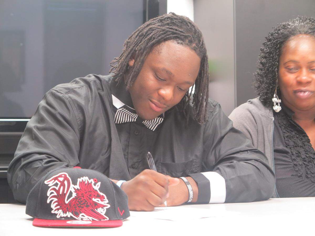 Joe Blue signs to play at South Carolina in 2014.
