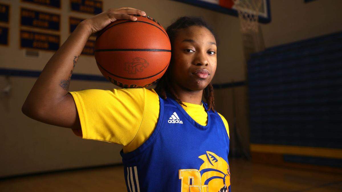 Divine Bourrage, a guard for Davenport North’s girl’s basketball team, poses for a portrait Wednesday, Nov. 29, 2023 at Davenport North High School.
