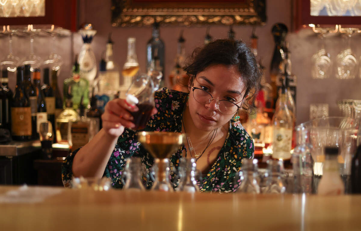 Caitlin Britt mixes a drink at the Lula Drake Wine Parlour in Columbia on Tuesday, March 26, 2024.