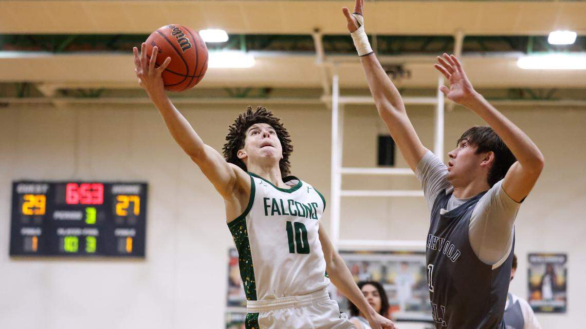 Maddox Stockman (10) of Ben Lippen puts up a shot as Henry Morris (1) of Heathwood Hall defends during Ben Lippen’s game against Heathwood Hall in Columbia on Tuesday, January 20, 2026.
