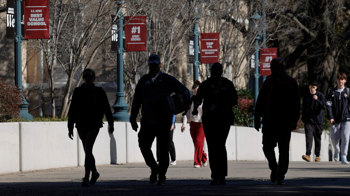 Students walk across campus at the University of South Carolina in Columbia.